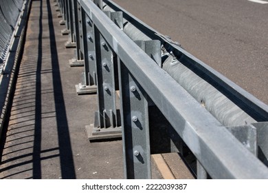 A Road Barrier On A Bridge Highway. Median Emergency Barriers To Protect Vehicles From Accidents.