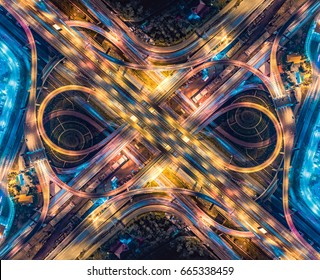 Road beautiful Aerial View of Busy Intersection , top view , Thailand at night