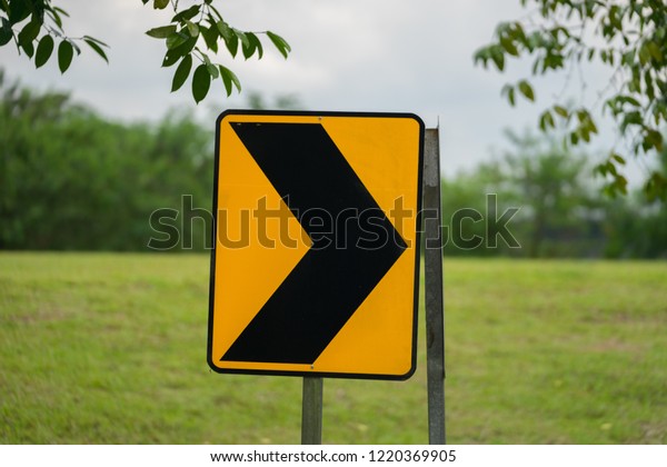 Road bend\
sign
