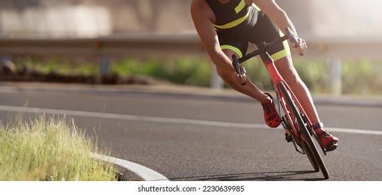 Road bike cyclist man cycling, athlete on a race cycle. Leaning into a corner - Shutterstock ID 2230639985
