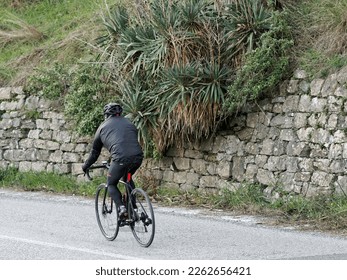 Road bike cyclist man cycling, athlete on a race cycle - Shutterstock ID 2262656421