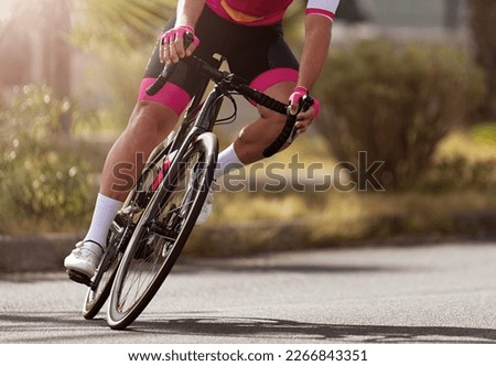 Road bike cyclist man cycling, athlete on a race cycle. Leaning into a corner