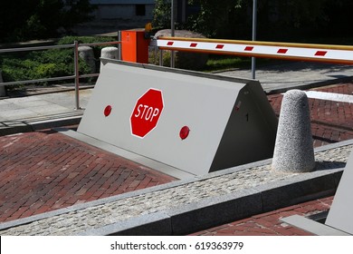 Road blockade - anti terrorism measure. Anti-ram automatic roadblocker wedge. - Shutterstock ID 619363979