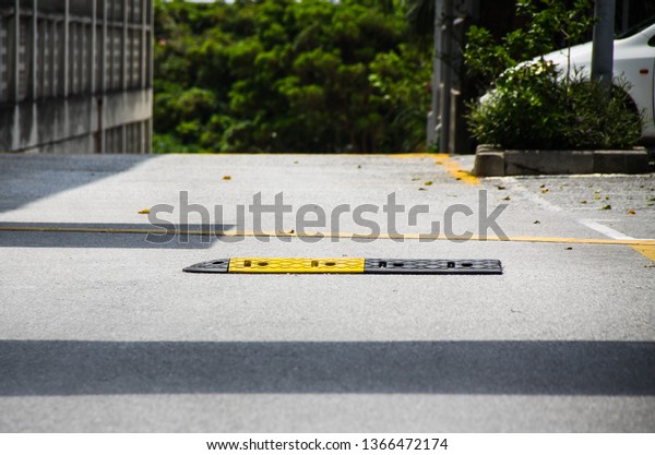 road bump to reduce speed or\
slow down car, concept image for warning ,caution and road safety.\
