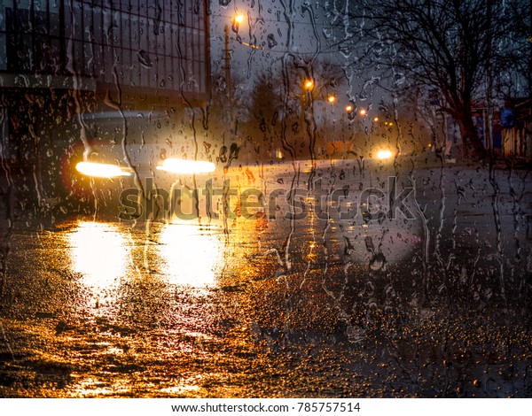 Road car evening rain city lighting lights light\
glare wet glass