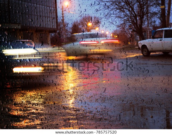 Road car evening rain city lighting lights light\
glare wet glass