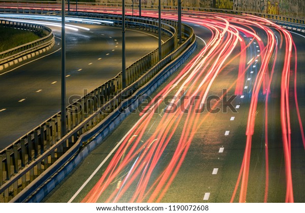Road car light streaks. Night light painting
stripes. Long exposure
photography.