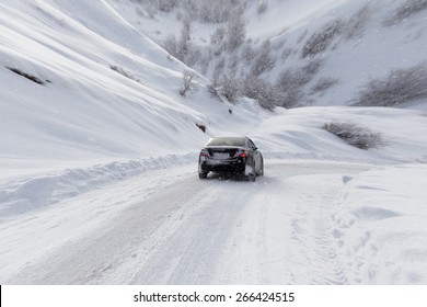road with a car in winter in the mountains