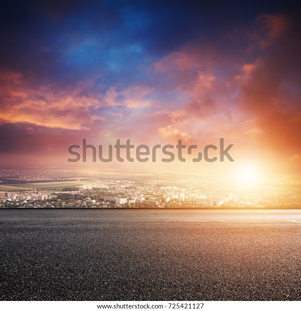 Road and\
cityscape at sunset. Urban\
landscape