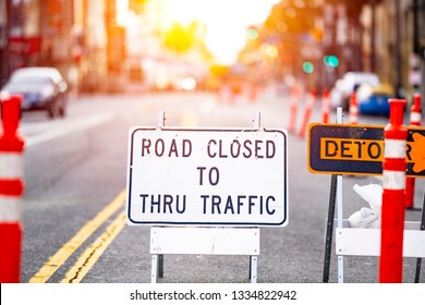 Road Closed And Detour Sign In A Road Construction Site Work Zone In The Middle Of A Blocked Street And Traffic