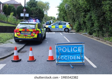 Road Closed Due To Accident Sign With Police Cars In The Background. Upholland, Lancashire, UK, 04-06-2021: 