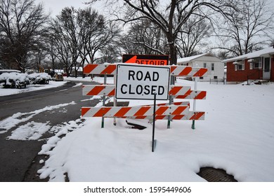 A Road Closed Sign In The Snow. There Is Also A Detour Sign That’s Cut Off By The Other Sign. Picture Taken In A Kansas City, Missouri Neighborhood.