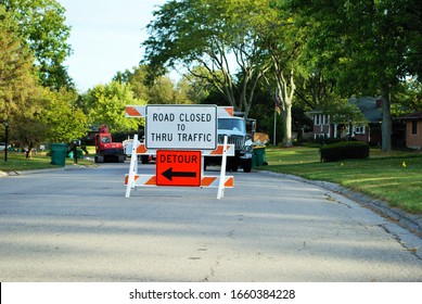 Road Closed To Thru Traffic Detour Construction Sign In A Residential Neighborhood