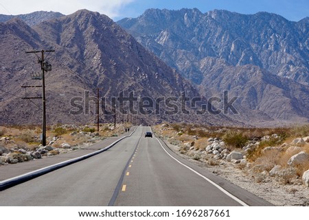 Road in Coachella Valley in Colorado Desert near Palm Springs with San Jacinto Mountains