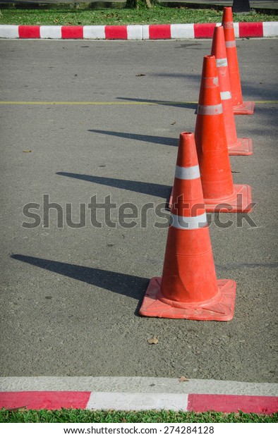 road cone on the\
asphalt