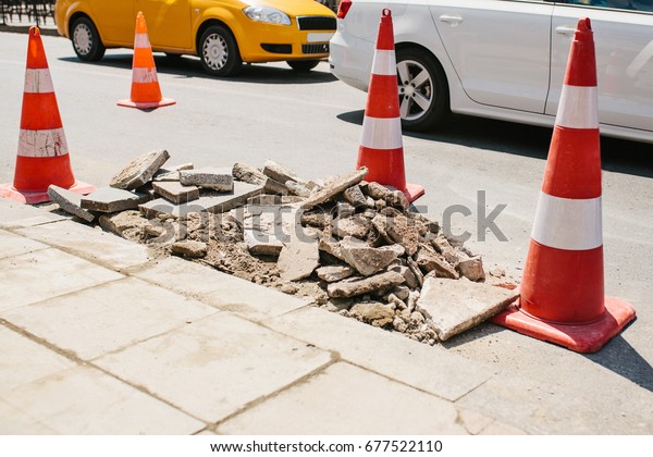 Road cone on the road. Road sign. Road\
works on the streets of Istanbul in Turkey.\
Sign.