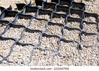 Road Construction. Cellular Confinement System - Plastic Black Frame Filled With Fine Gravel. It Is Used In Construction Of Roads To Stop Erosion, Soil Stabilization On Flat Areas And Steep Slopes