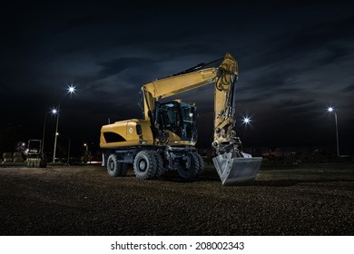 Road construction, close up of excavator at night