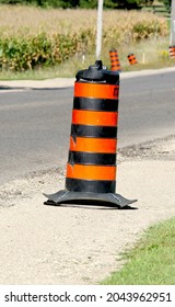 Road Construction Pylon Cone On Roadside On Sunny Day