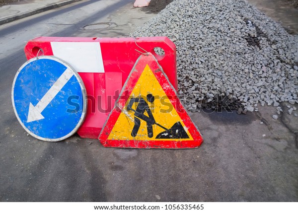Road\
construction site and road works traffic\
sign.