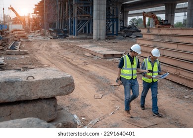 Road construction supervision team Civil engineers work at road construction sites to supervise new road construction and inspect road construction sites. - Powered by Shutterstock