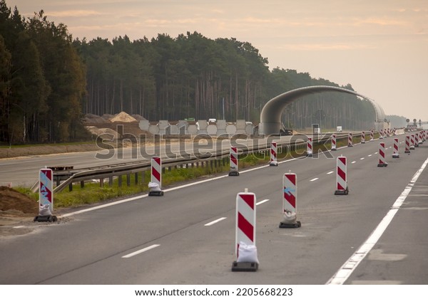 Road construction - the viaduct under\
construction in the\
background