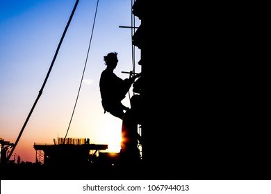 Road Construction worker at sunset.