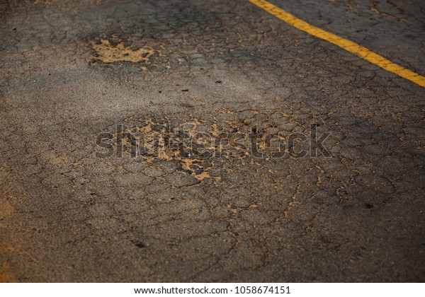 The road is\
cracked. Roads damaged and\
broken.
