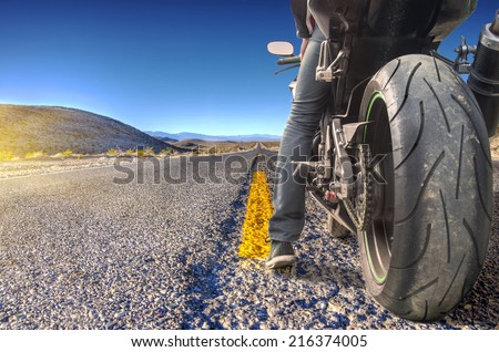 Road crossing the Death Valley, motorbike ready to ride