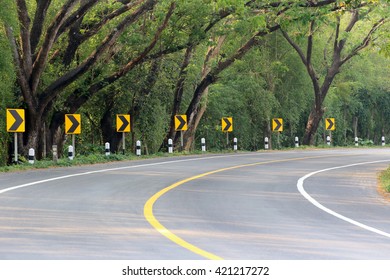 The Road Curve With Street Signs Reflex Light,At Night You Can See The Signs More Clearly.