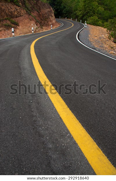 The road curved\
empty