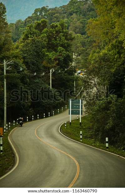 The road curves up the\
mountain.