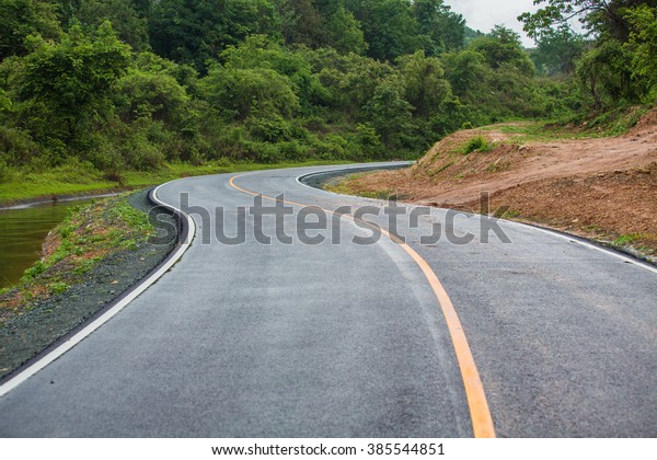 \
The road curves to the\
terrain.