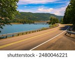 Road curving around Dexter Reservoir with Lowell Covered Bridge in Oregon. Dexter Reservoir, also known as Dexter Lake, is a reservoir in Lane County formed on the Middle Fork Willamette River.