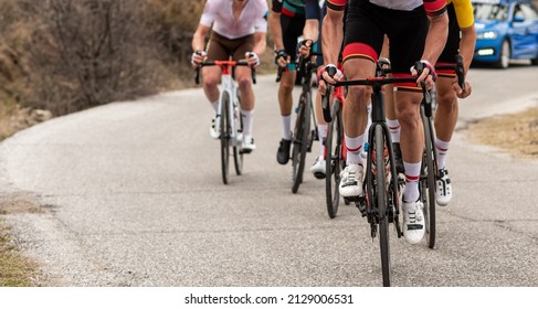 Road Cycling Race. Group Of People Doing Sport Cycling. Unrecognizable Men Using Racing Bike In A Cycling Event. Concept Sport.