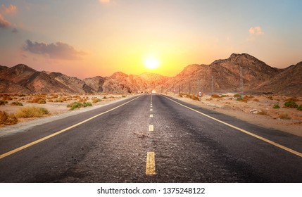 Road in the desert of Egypt at sunset