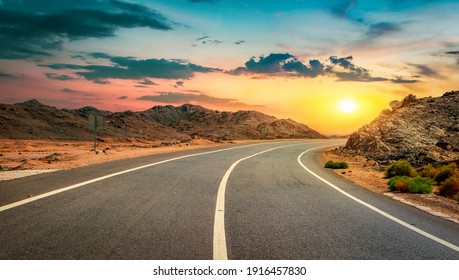 Road in the desert of Egypt at sunset