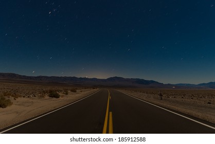 road and desert in the night - Powered by Shutterstock