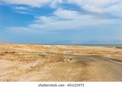 road in the desert to the sea with blue sky - Shutterstock ID 451121971