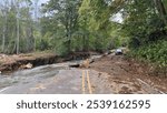 Road destruction from a hurricane in North Carolina.