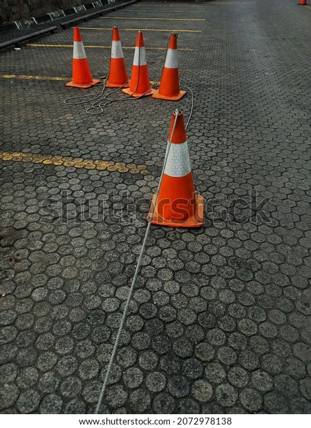 the road divider\
cone is not neatly arranged