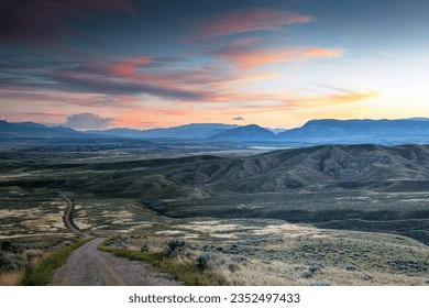 Road down to the Bighorn Basin and Cody Wyoming foothills at dusk.