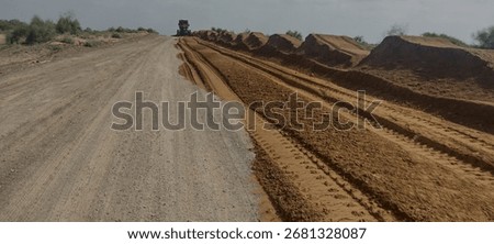Road earthwork involves modifying the natural terrain through activities like excavation, filling (embankment), grading, and compaction to create a stable, level foundation for a road. This crucial pr