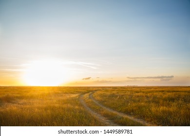 Road In A Field At Sunset