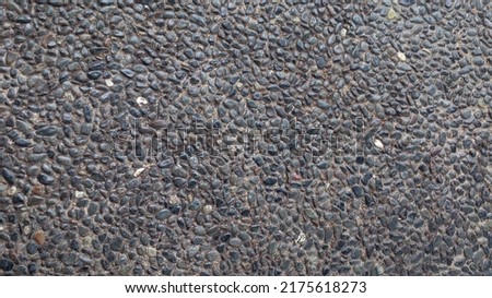 The road is formed from a collection of small stones that are neatly arranged. Cobblestone road as background. Foto stock © 