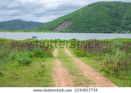 The road goes to the reservoir at Huai Phak Reservoir, Tha Yang District, Phetchaburi, Thailand.