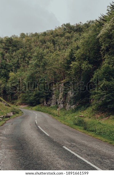Road going through Cheddar\
Gorge in the Mendip Hills, near the village of Cheddar, Somerset,\
England.
