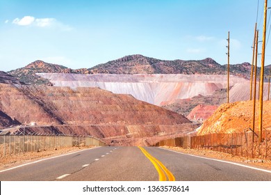 Road going through dramatic minefield landscape.