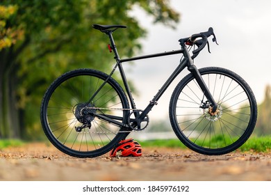 Road gravel bicycle on city street under trees. Green park and trees outdoors, urban scene bike under a tree, shallow depth of field. Commuting by bike. - Shutterstock ID 1845976192