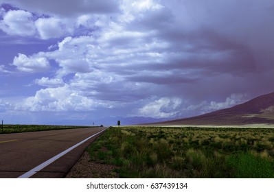 Road To Great Sand Dunes National Park, Ominous Storm Clouds And Road In Perspective With 